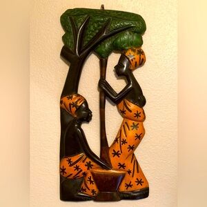 Handcrafted African Wall Art with Green and Yellow Accents.